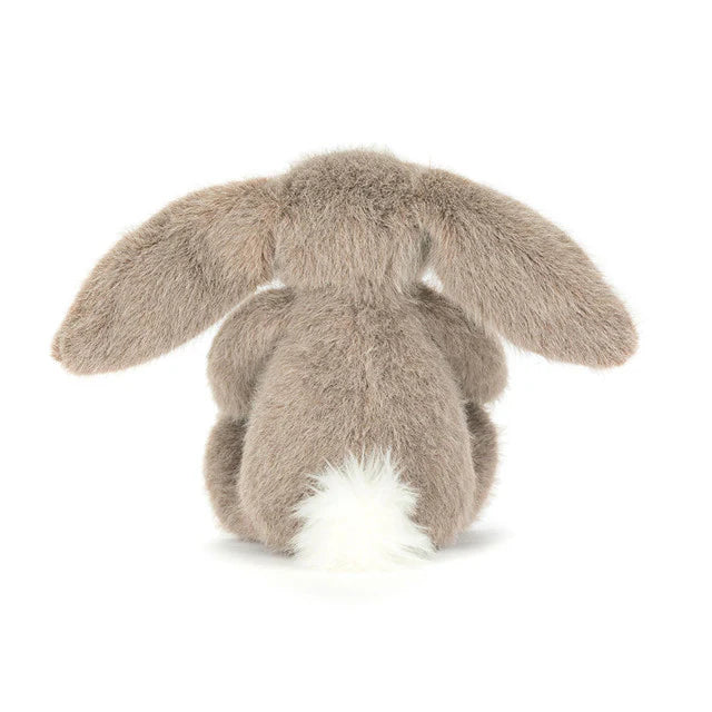Plush Jellycat toy rabbit with large ears and white cottontail on a white background