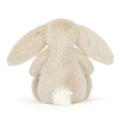 Plush bunny toy on a white background