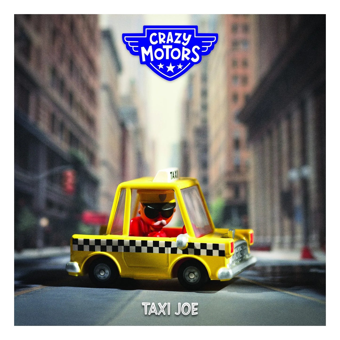 A yellow toy taxi with a small driver figure wearing a red shirt and black sunglasses, shown on a blurred city street. The image has a blue 'Crazy Motors' logo at the top and the text 'Taxi Joe' at the bottom.