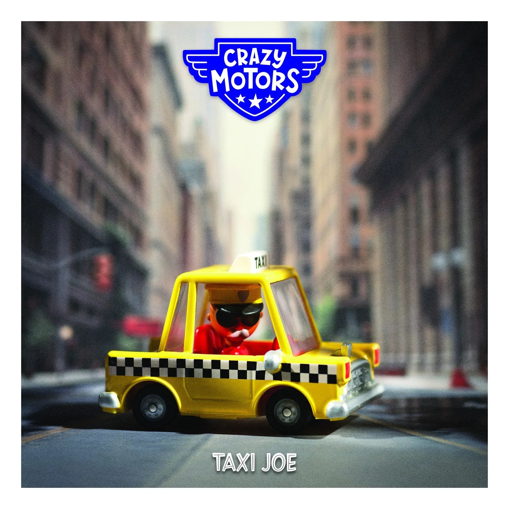 A yellow toy taxi with a small driver figure wearing a red shirt and black sunglasses, shown on a blurred city street. The image has a blue 'Crazy Motors' logo at the top and the text 'Taxi Joe' at the bottom.