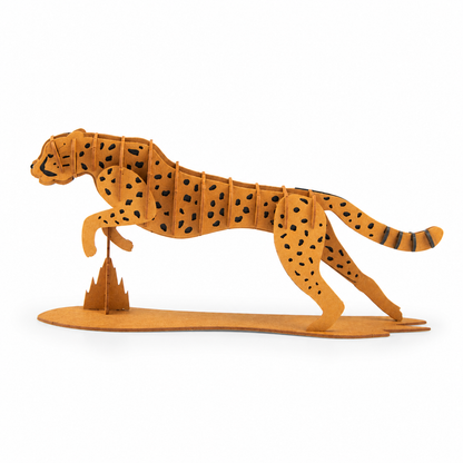 A 3D wooden model of a cheetah in a running pose, standing on a small abstract mountain structure, set against a plain white background.