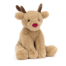 A plush toy reindeer with beige fur, brown antlers, and a red nose.