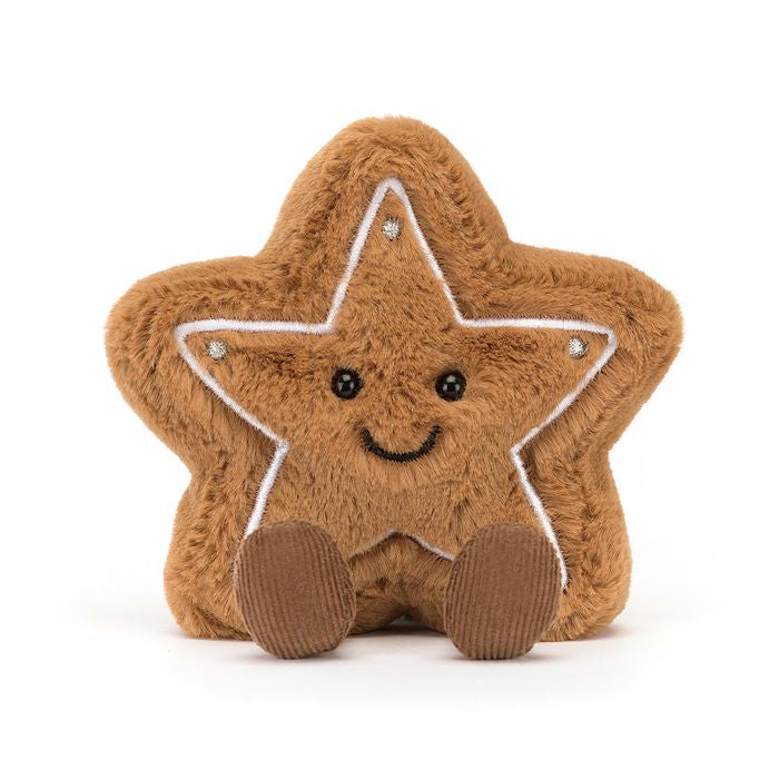 A plush toy in the shape of a star cookie with brown biscuit fur, cordy boots, and a big stitched smile.