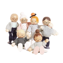 Wooden family figurines with different clothing styles on a white background
