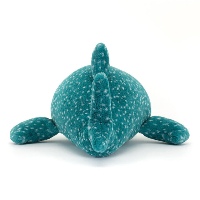 Teal plush toy with white speckles on a white background