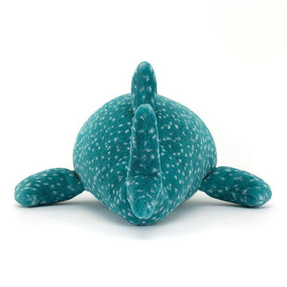 Teal plush toy with white speckles on a white background