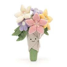 Toy bouquet with colorful flowers wrapped in a cloth with a smiling face on a white background