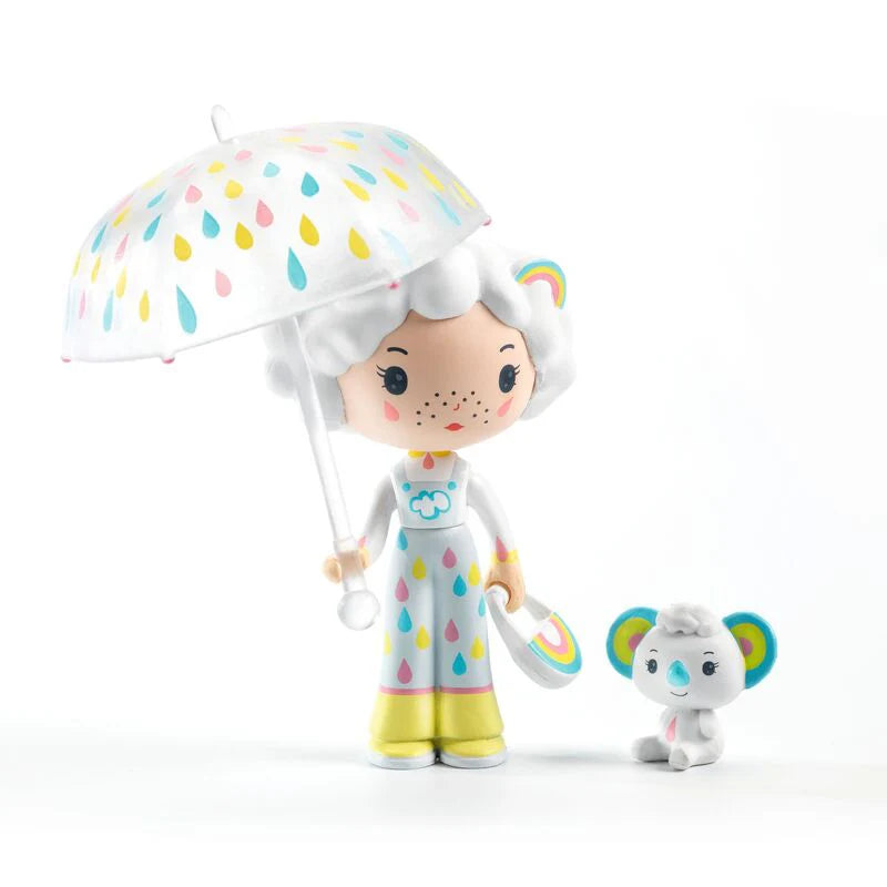 Toy figure with colorful umbrella and matching toy on a white background