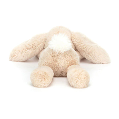 Beige plush bunny toy on a white background