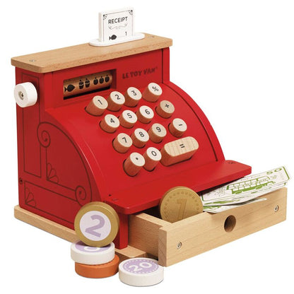 Red toy cash register with wooden accents on a white background