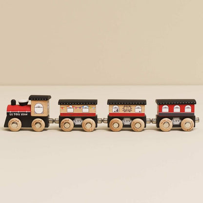 Wooden toy train set on a beige background