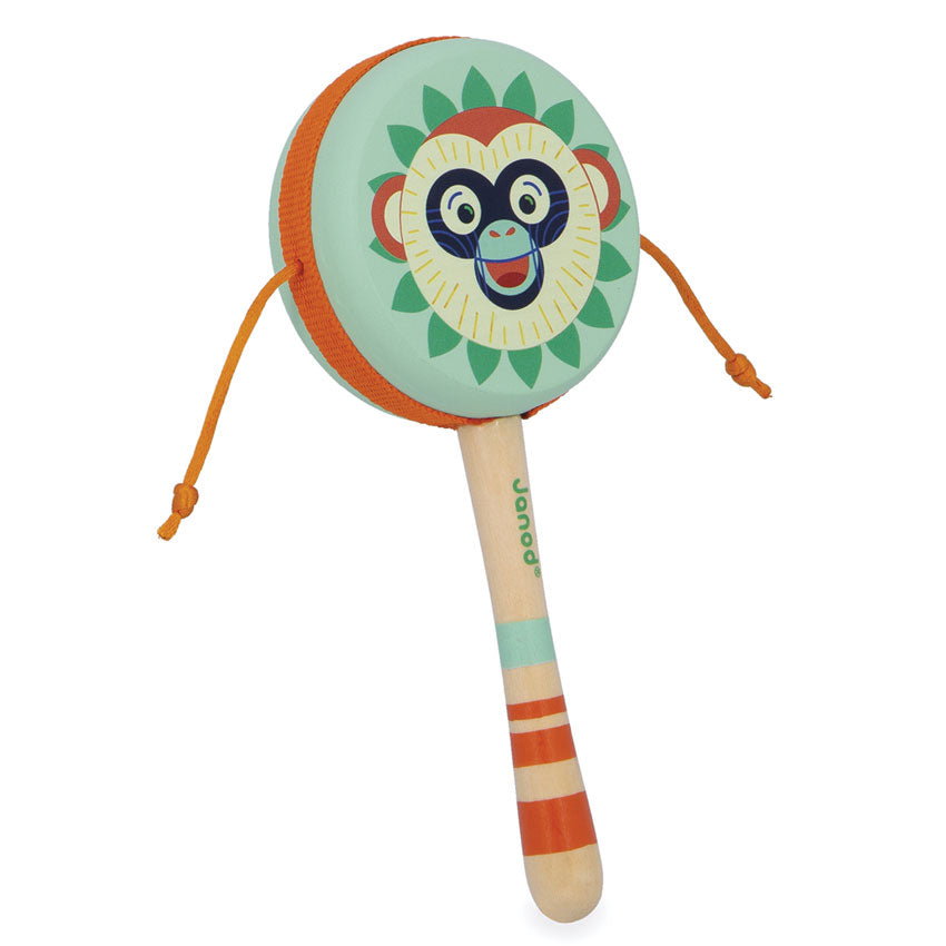 Colorful monkey-themed rattle hand drum toy on a white background