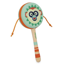 Colorful monkey-themed rattle hand drum toy on a white background