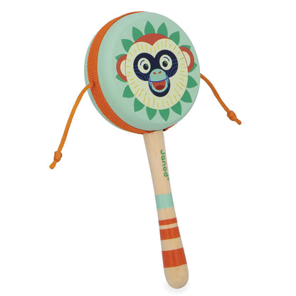 Colorful monkey-themed rattle hand drum toy on a white background
