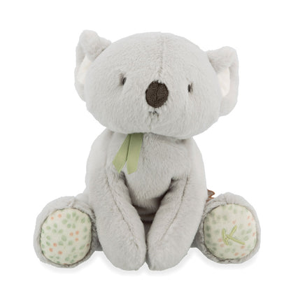 Sitting grey koala soft toy on a white background