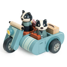 Toy motorcycle with two badger animal characters and a sidecar on a white background