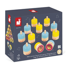 Box of Janod wooden memory game with colorful cylindrical pieces on a white background