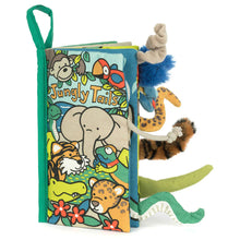 padded fabric book with jungle animal illustrations and 3D animal tails poking out.