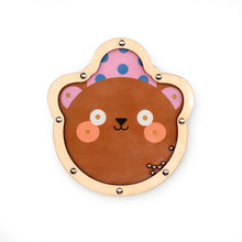 A double sided wooden tilt puzzle game designed with animal shapes, one side brown bear and the other side panda, for children.