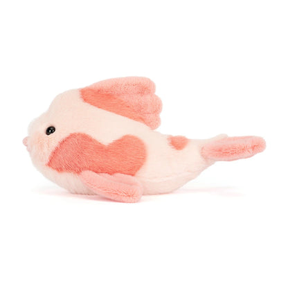 Plush toy fish with a heart pattern on a white background