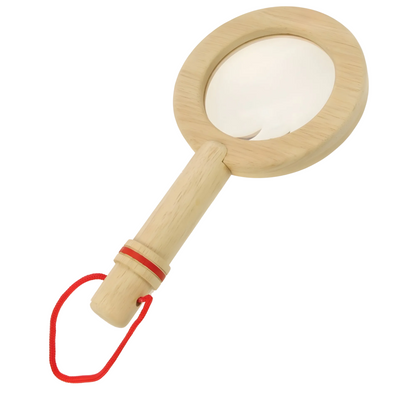 Wooden magnifying glass with a red strap on a white background