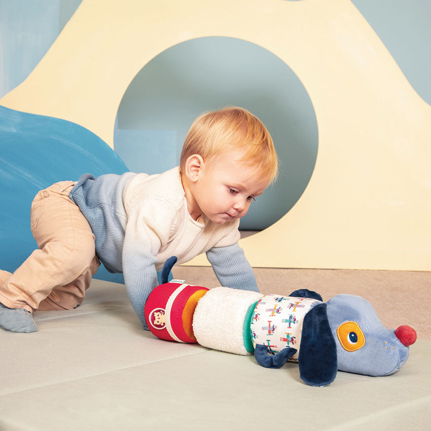 Child playing with a colorful toy in a playroom