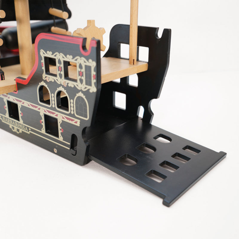 Wooden toy ship with detailed design on a white background