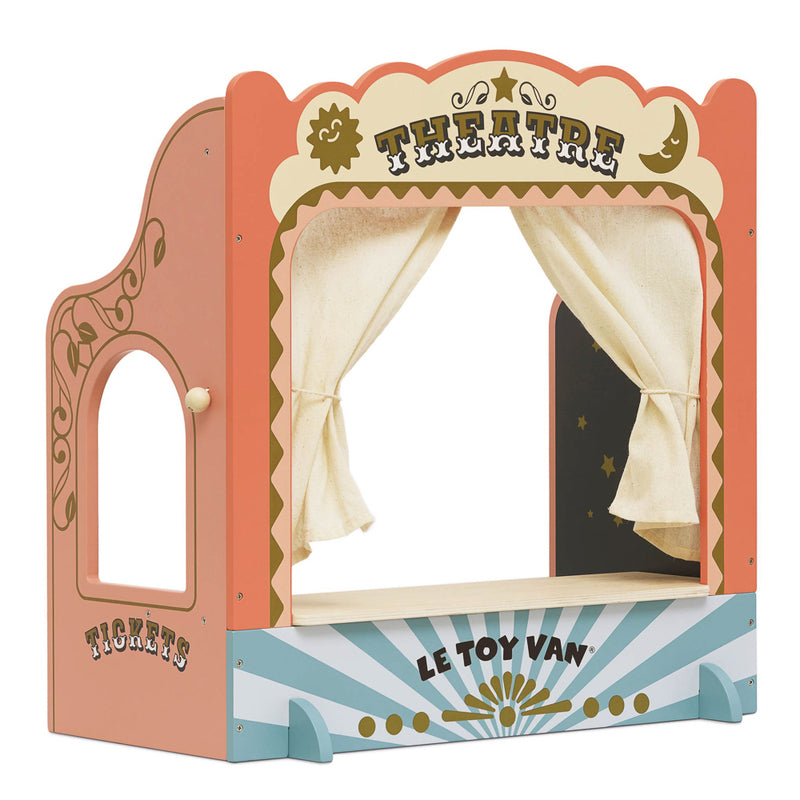 A colorful tabletop puppet theater with a show curtain, ticket window booth, and chalkboard showtime board. The theater is designed with a vibrant, theatrical backdrop and gold paint details.