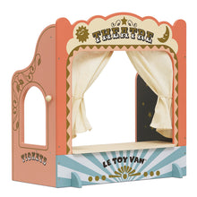 A colorful tabletop puppet theater with a show curtain, ticket window booth, and chalkboard showtime board. The theater is designed with a vibrant, theatrical backdrop and gold paint details.