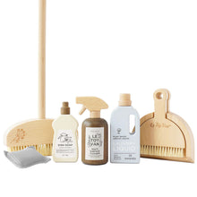 A wooden cleaning set including a broom, dustpan, surface cleaner, dish soap, and laundry liquid, with stained walnut finish.