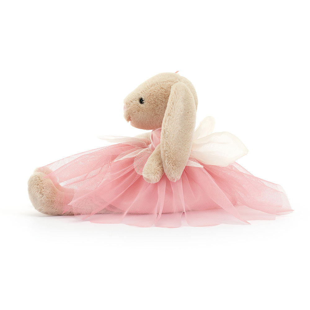 A plush toy depicting a beige bunny with pink ribbon ears, dressed in a pink ballet costume with a tutu.