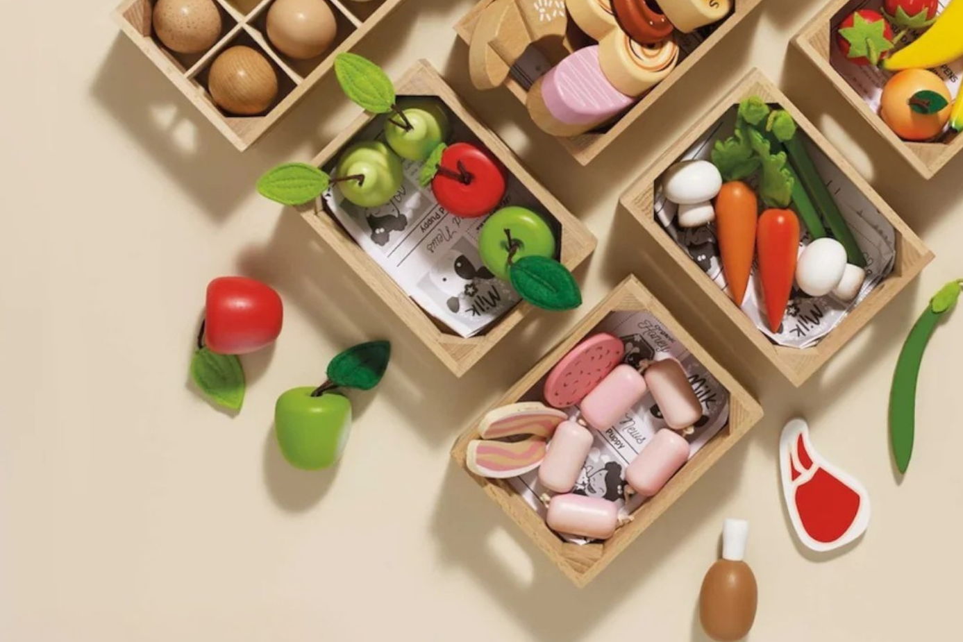LE TOY VAN toy food set with fruits, vegetables, and wooden crates on a beige background