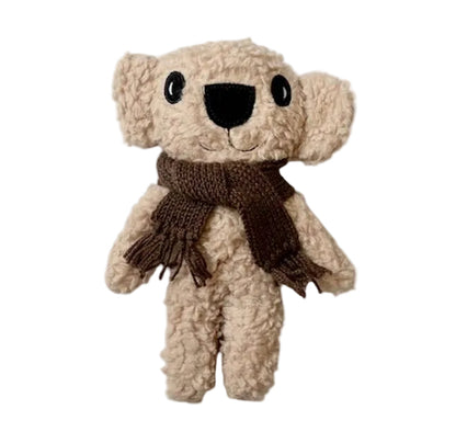 Plush teddy style koala with a brown scarf on a white background