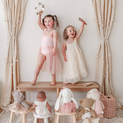 Two children with the Love Note Co Little Sounds Music Set in a softly styled nursery.
