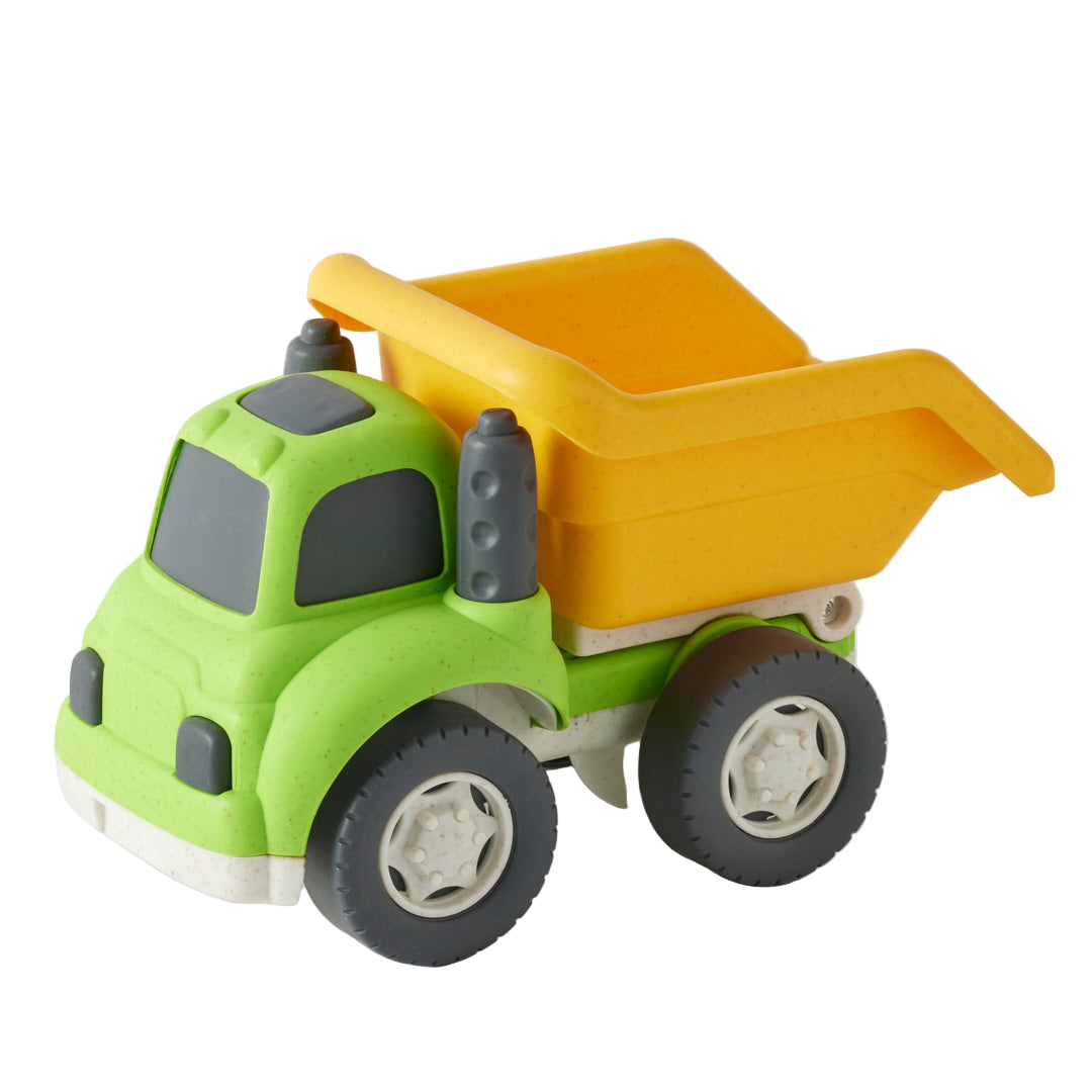Toy dump truck with green body and yellow bed on a white background