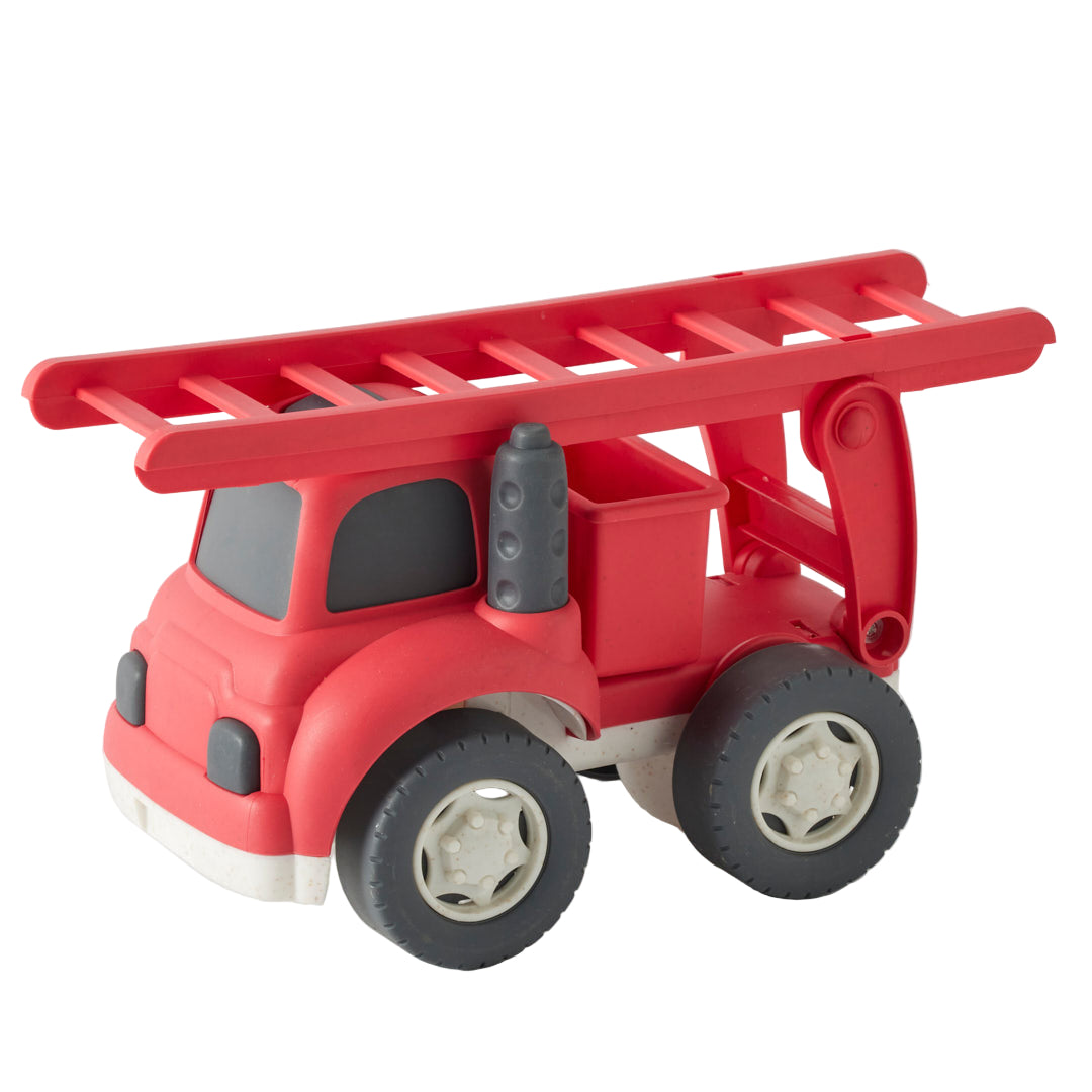 Red toy fire truck with a ladder on a white background