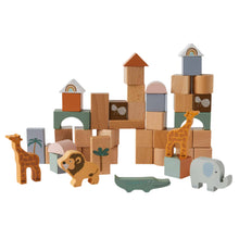 A variety of wooden blocks and animal figures arranged in a playful cityscape, featuring colors and themes indicative of an African safari.