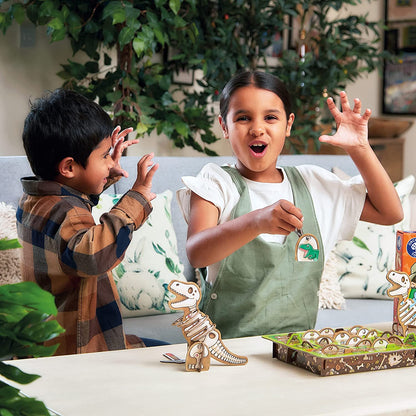 Two children playing with dinosaur toys on a table, surrounded by plants.