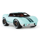 Model car with turquoise body and black stripes on a white background