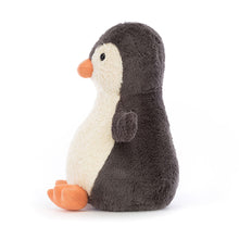 Plush penguin toy on a white background