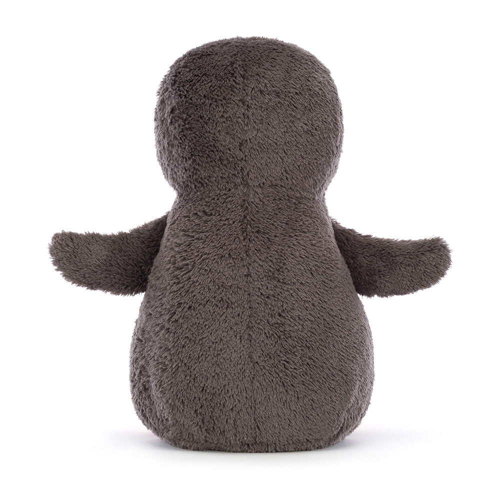 Plush toy resembling a penguin on a white background