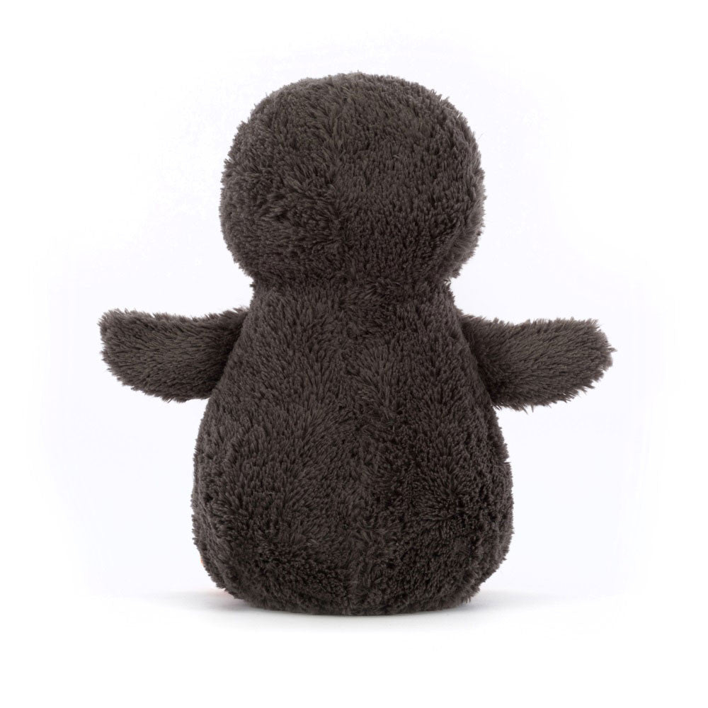 Plush toy penguin on a white background