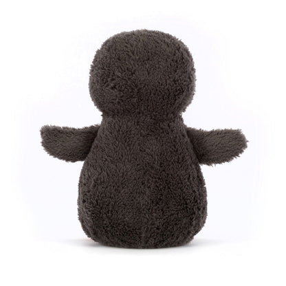 Plush toy penguin on a white background