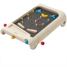A wooden pinball game with colorful elements, including flipper buttons and obstacles, on a gray playfield set on a white base.