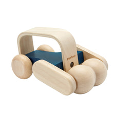 A wooden massage roller toy with blue accents and rounded body designed for push play.