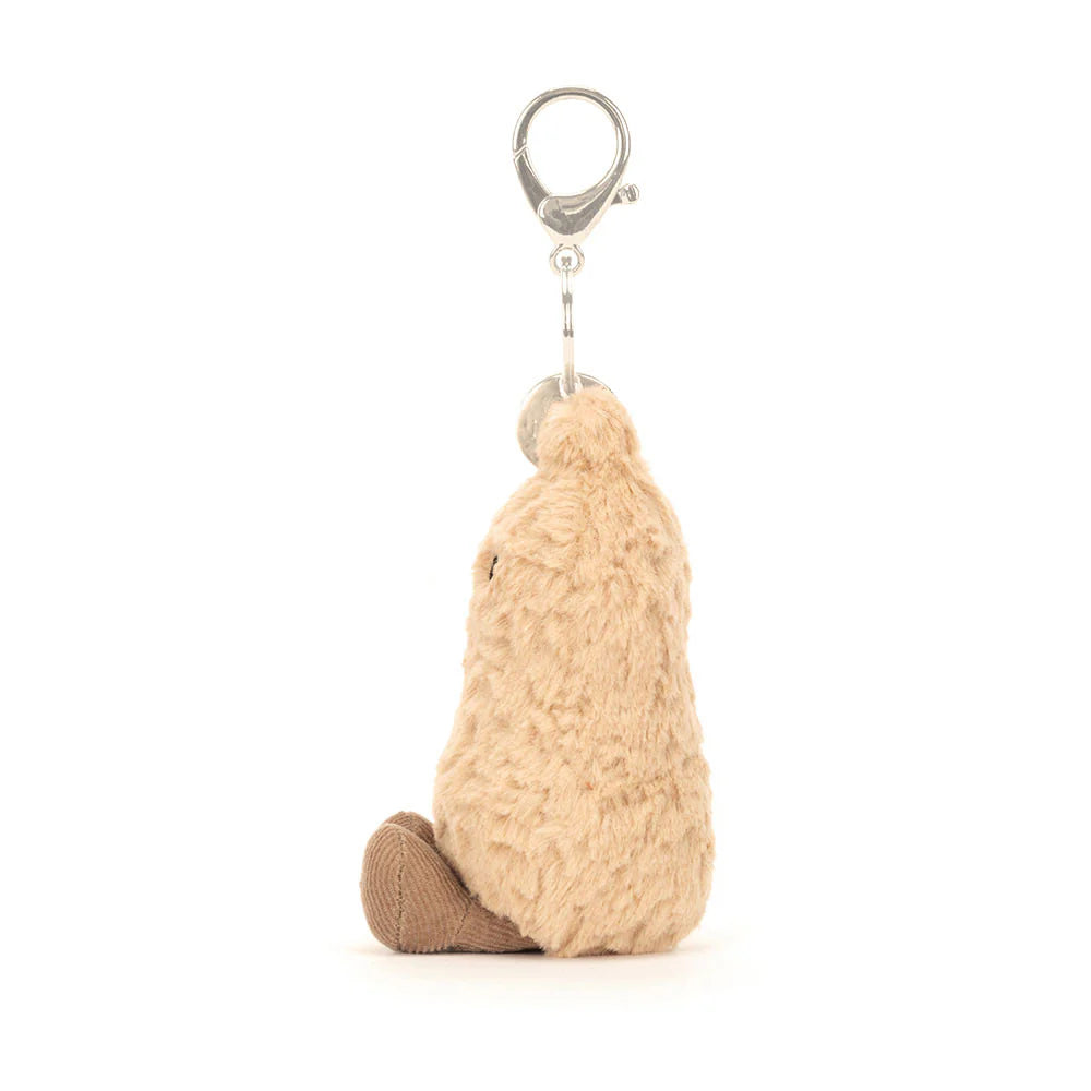 Plush keychain resembling a peanut on a white background
