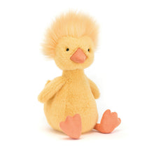 A plush toy duckling with bold yellow fur and a funky yellow hairdo, featuring little wings, a high tail, a soft orange beak, and matching long legs.
