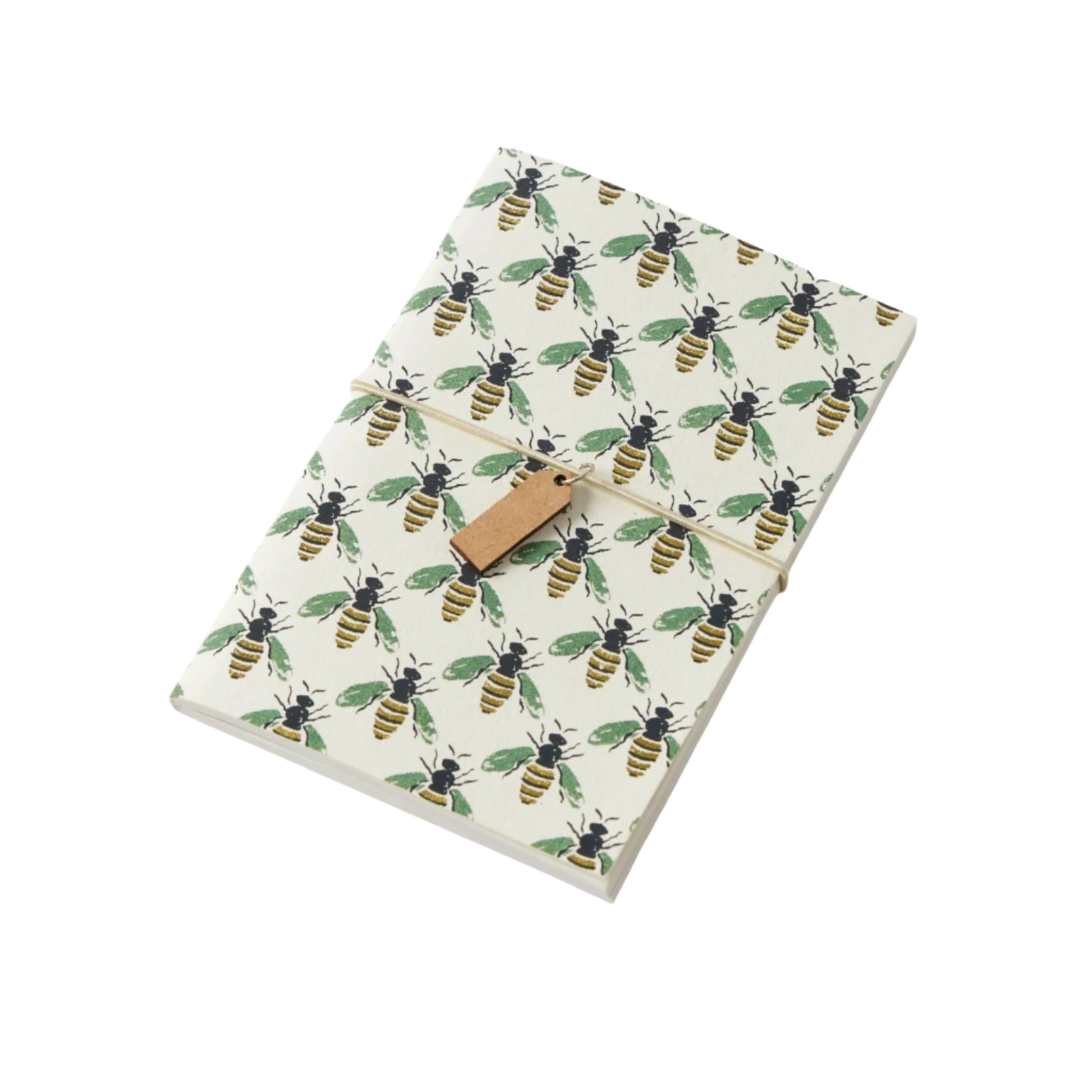 A pocket notebook with a beige cover featuring a green and yellow bee pattern and a brown closure.