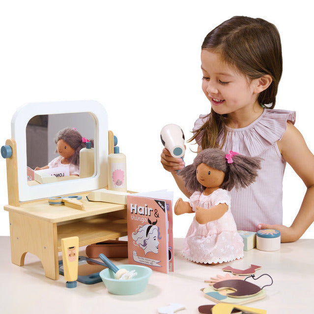 Young girl playing with wooden Hair Dressing pretend play set by Tender Leaf Toys - Send A Toy