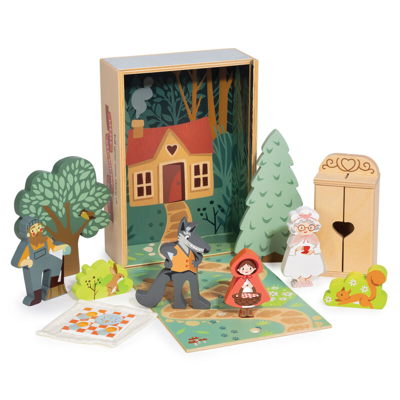 Wooden fairy tale set with characters and a house in a box on a white background